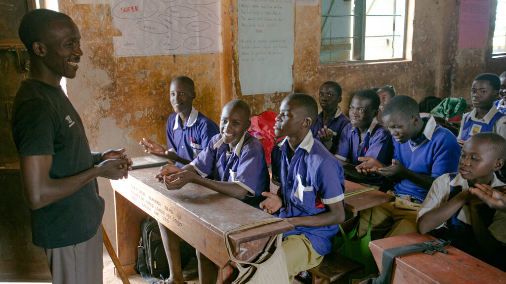 Pupils sit in a classroom at a sign language school in Uganda.